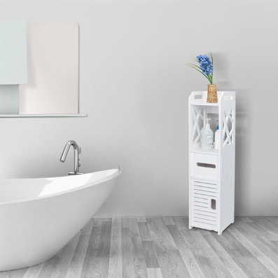 Slim white freestanding bathroom storage cabinet in a corner, with open top shelf, drawer, and louvered door