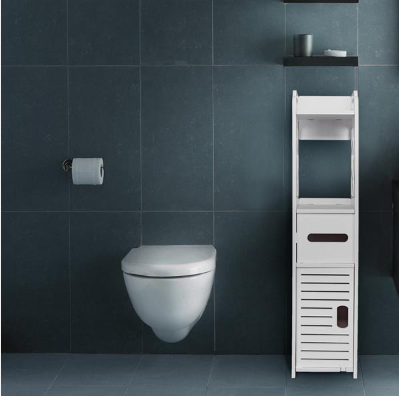 White bathroom storage cabinet standing on the floor next to the toilet, showing drawer and louvered cabinet door